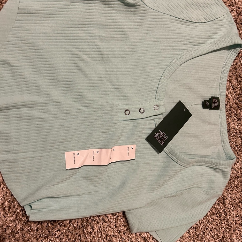 crop top with three buttons on the top brand new with tags